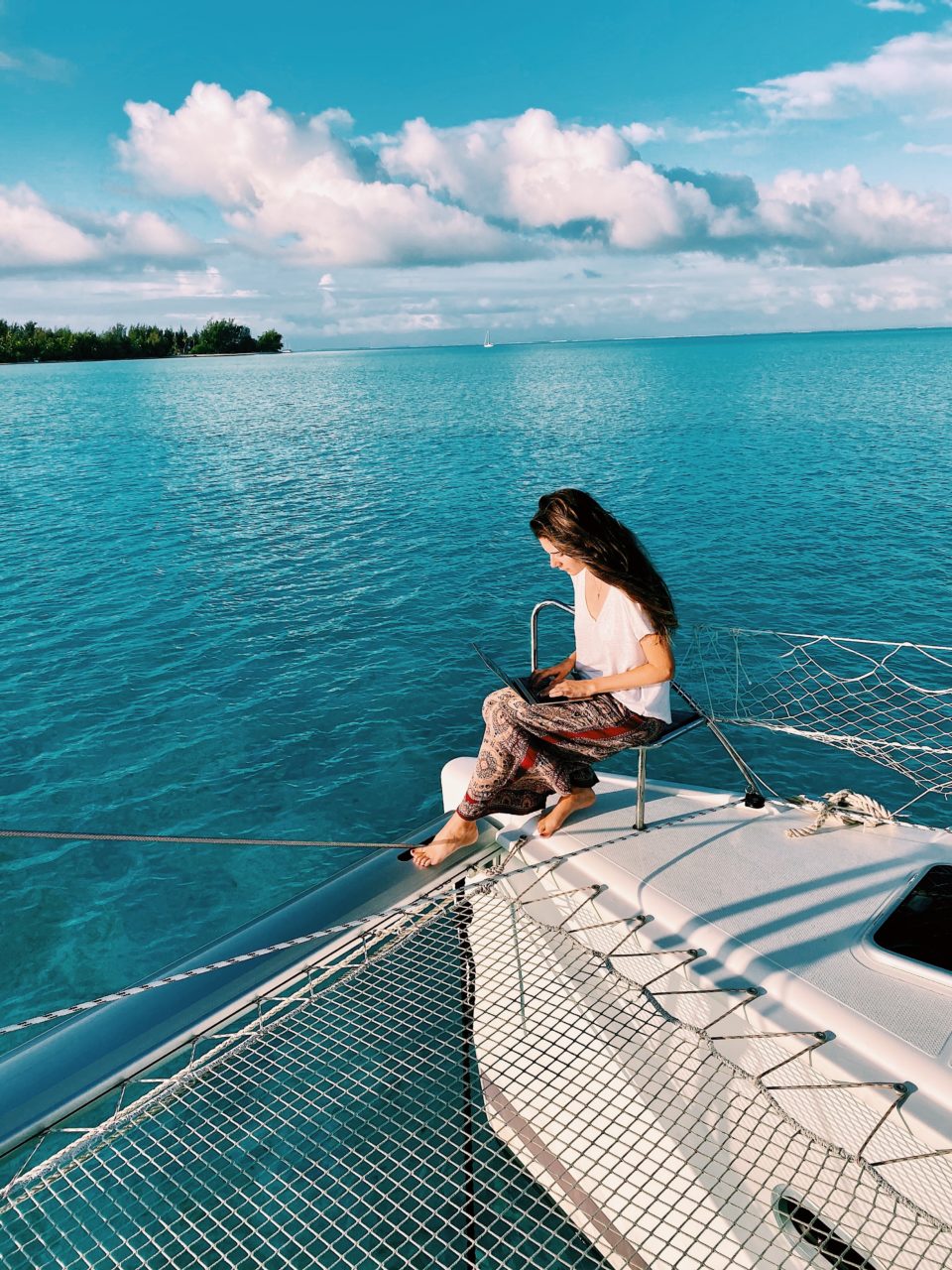 Dylan, the travel writer, writing about her experiences in the island of Bora Bora